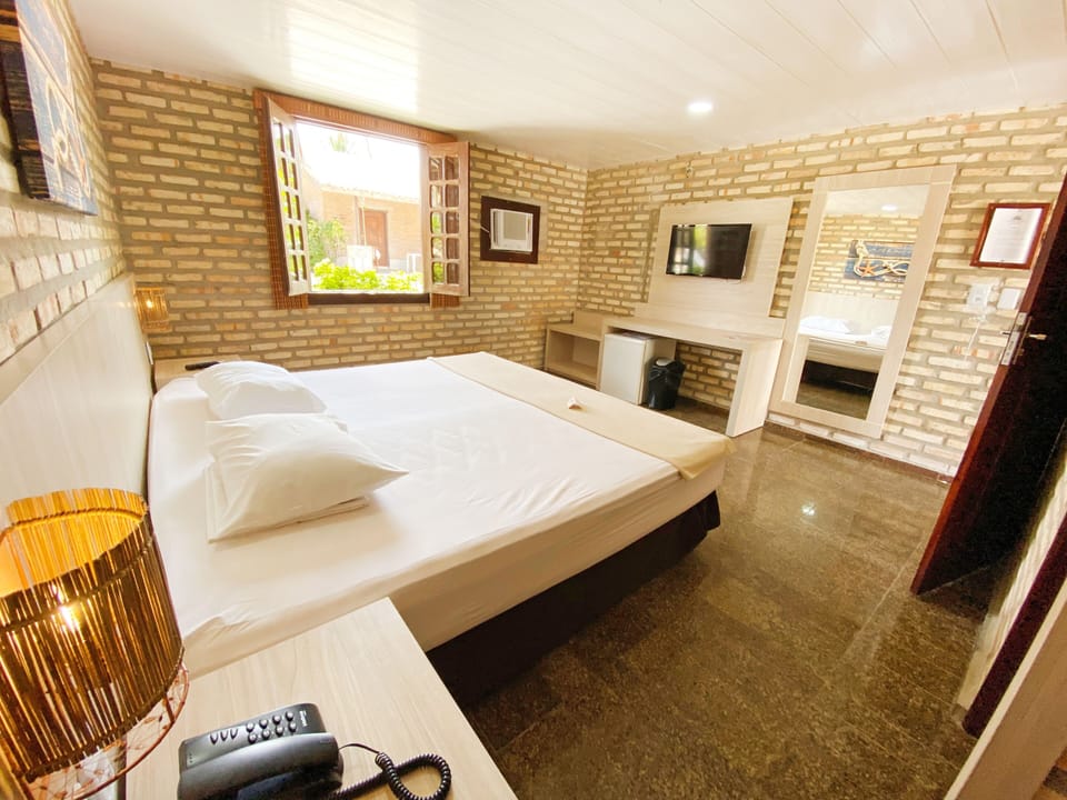 Junior Chalet, Garden View | In-room safe, free cribs/infant beds, bed sheets