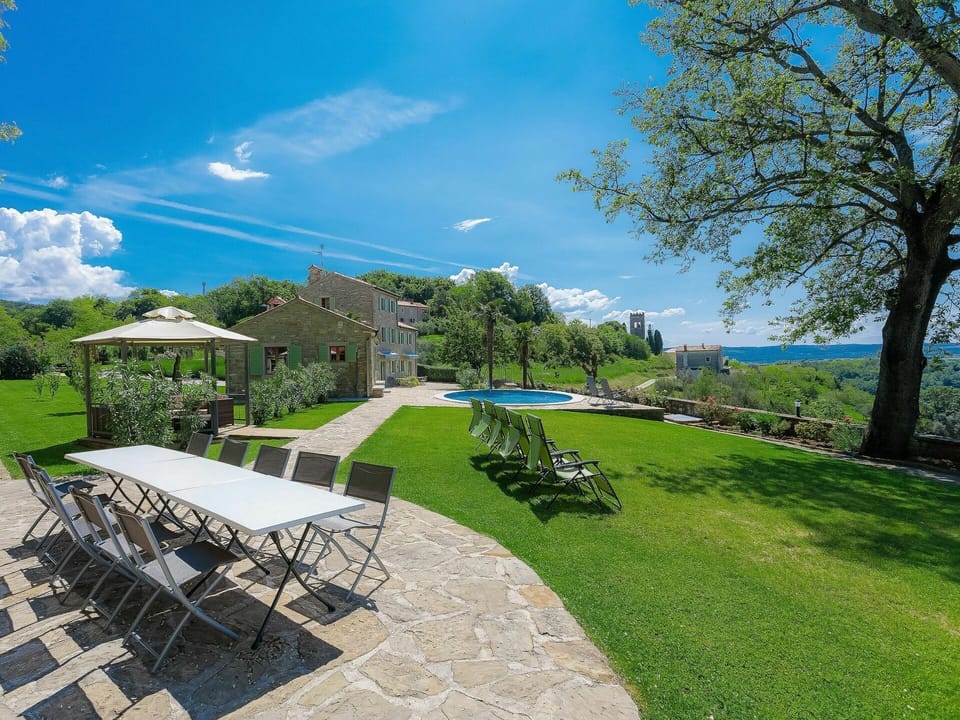 Cloud, Sky, Plant, Building, Tree, Natural Landscape, Shade, Table, Outdoor Furniture, Land Lot