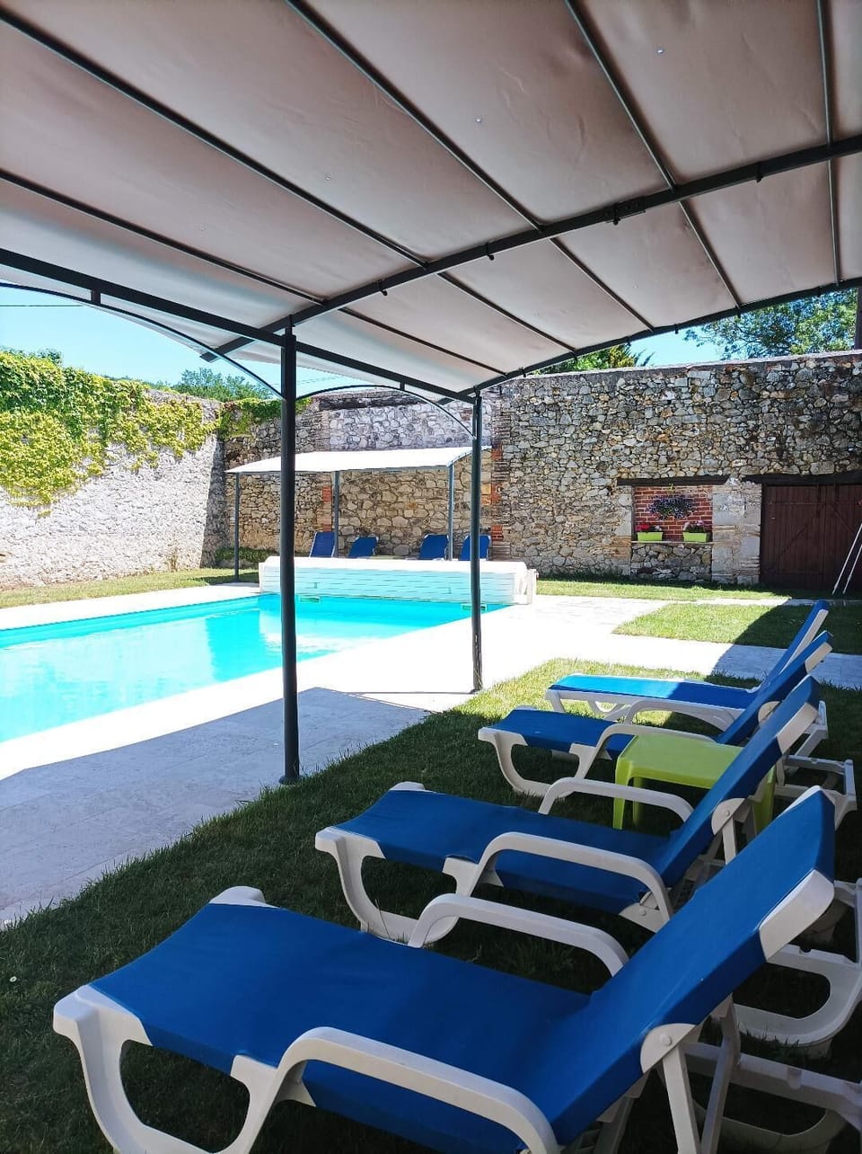 pool with two large awnings for shade