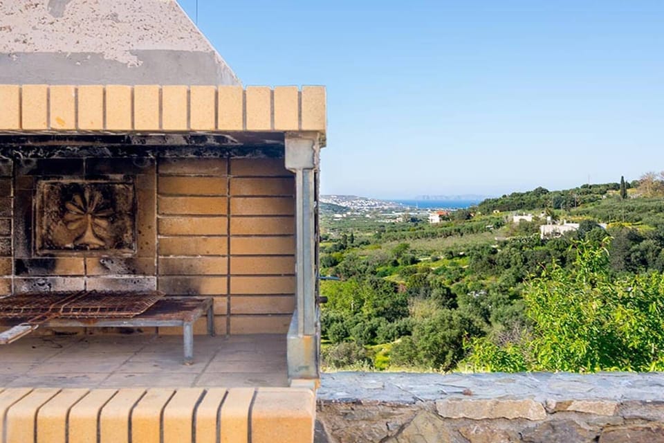 Coal bbq with view over the estate and towards the sea