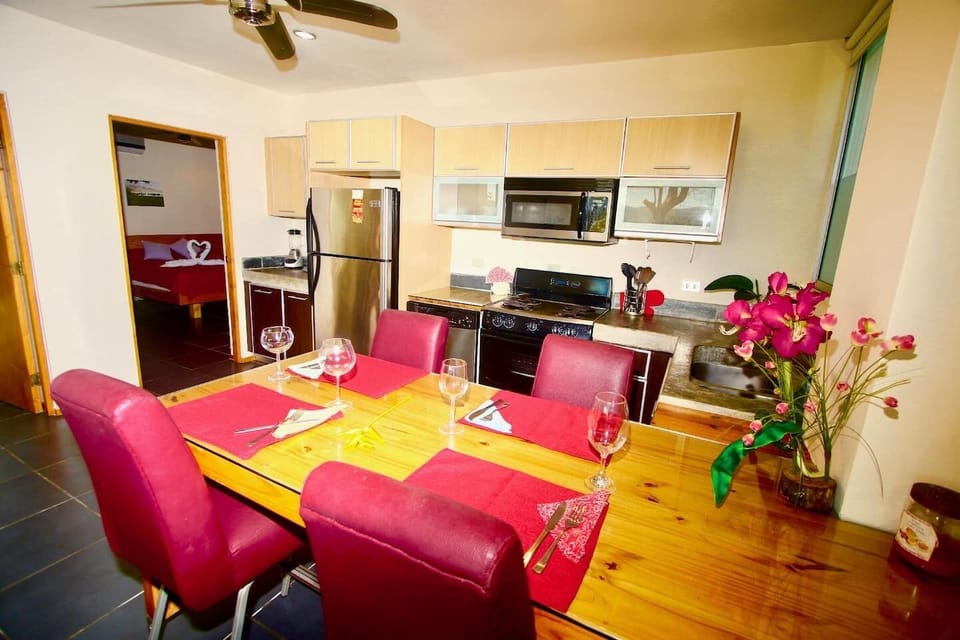 Dining table for four.  It is possible to bring in the balcony table to sit more.