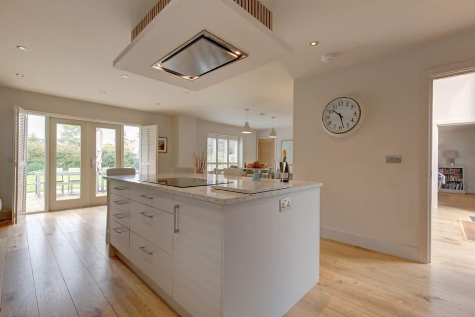 Ground floor: Open plan kitchen/diner with french doors to patio and garden