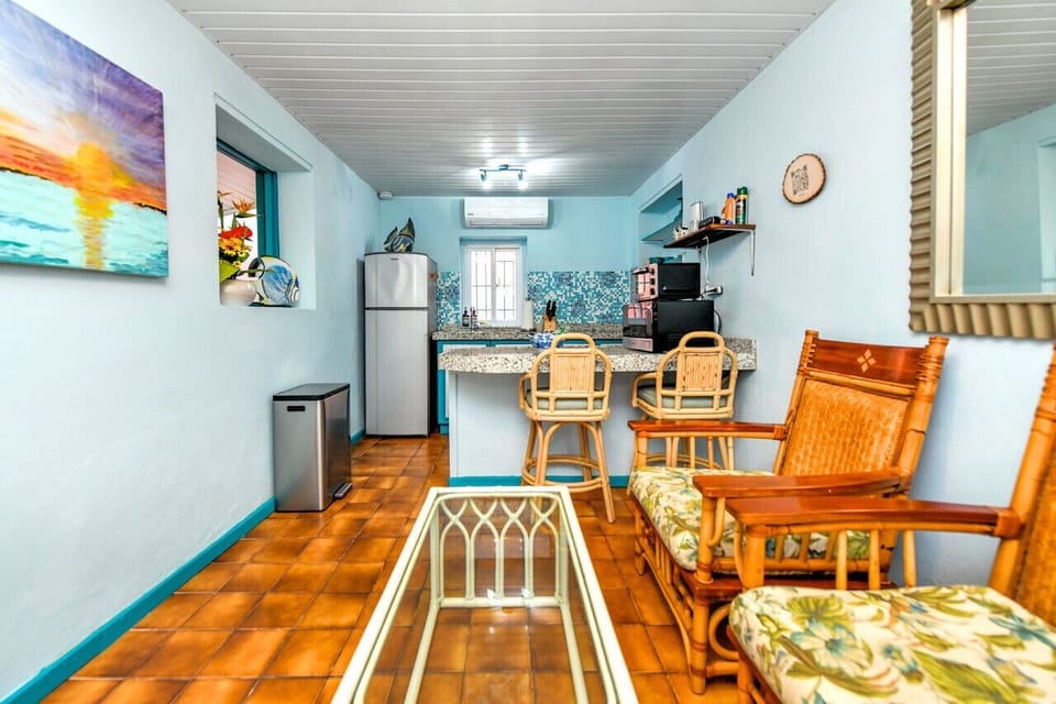 Experience ultimate relaxation in our bathroom featuring shower with water heater, comfy toilet and bath towels. Perfect for unwinding after a day explorer Aruba