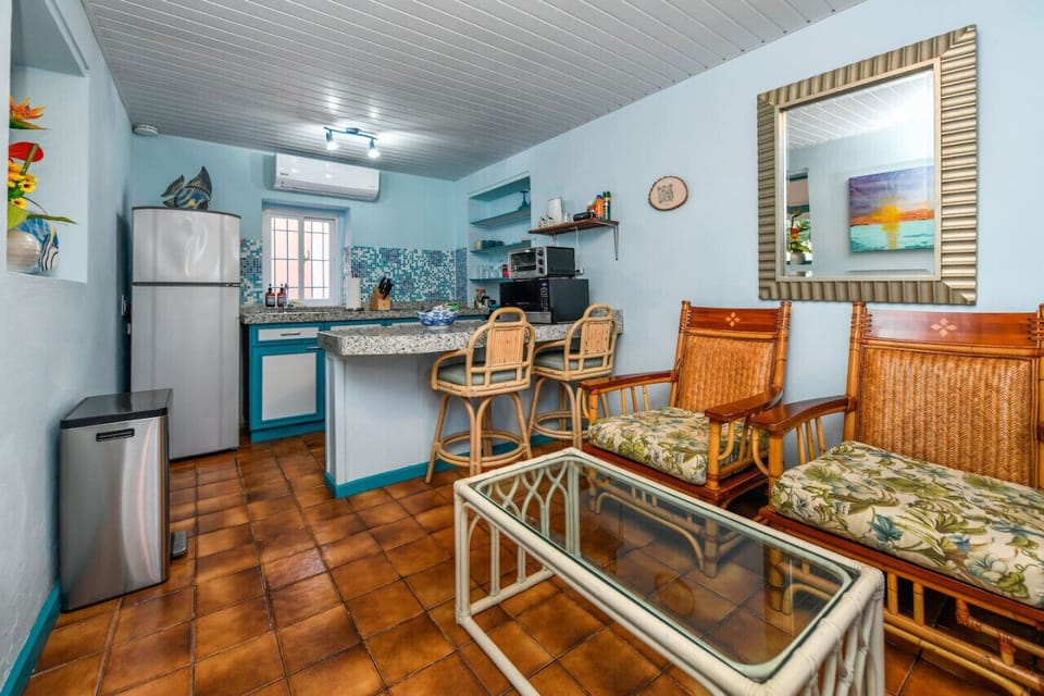 Experience ultimate relaxation in our bathroom featuring shower with water heater, comfy toilet and bath towels. Perfect for unwinding after a day explorer Aruba