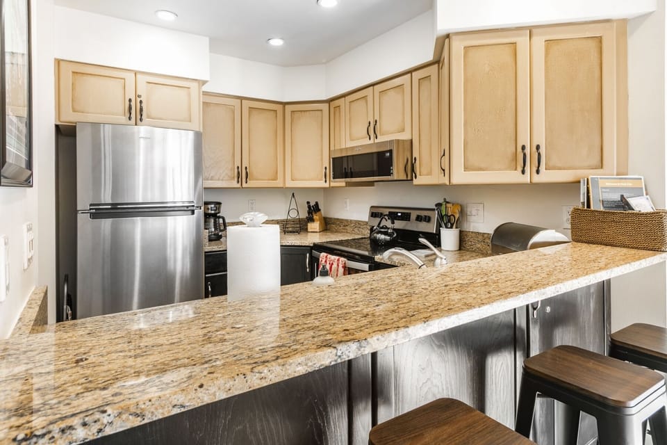 Kitchen & Bar with seating.