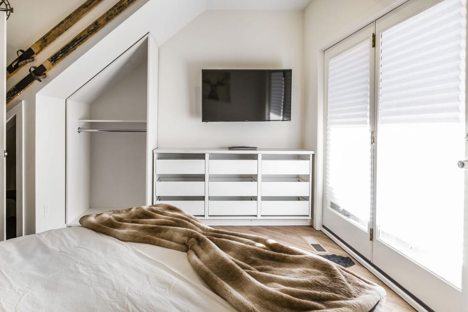 Queen Bedroom, plenty of storage, access to balcony.
