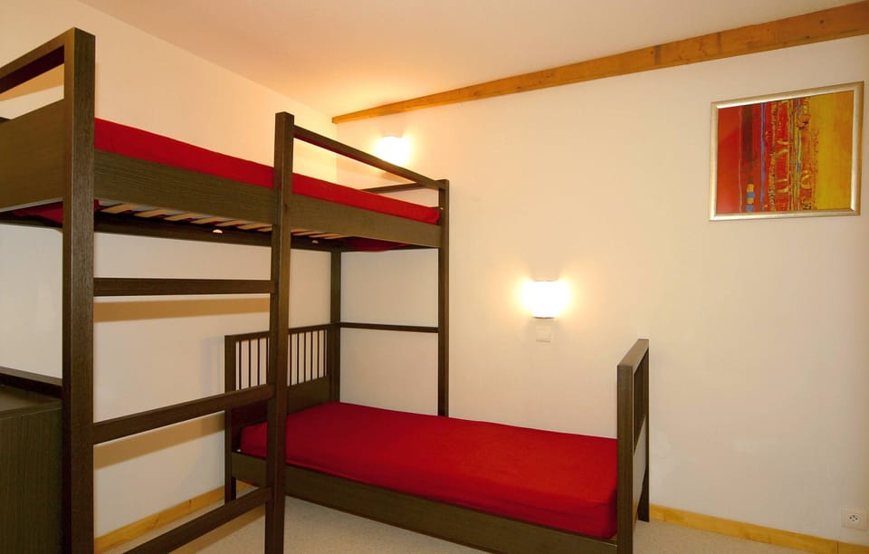 The sleeping alcove may contain a Bunk bed or a Trundle bed.