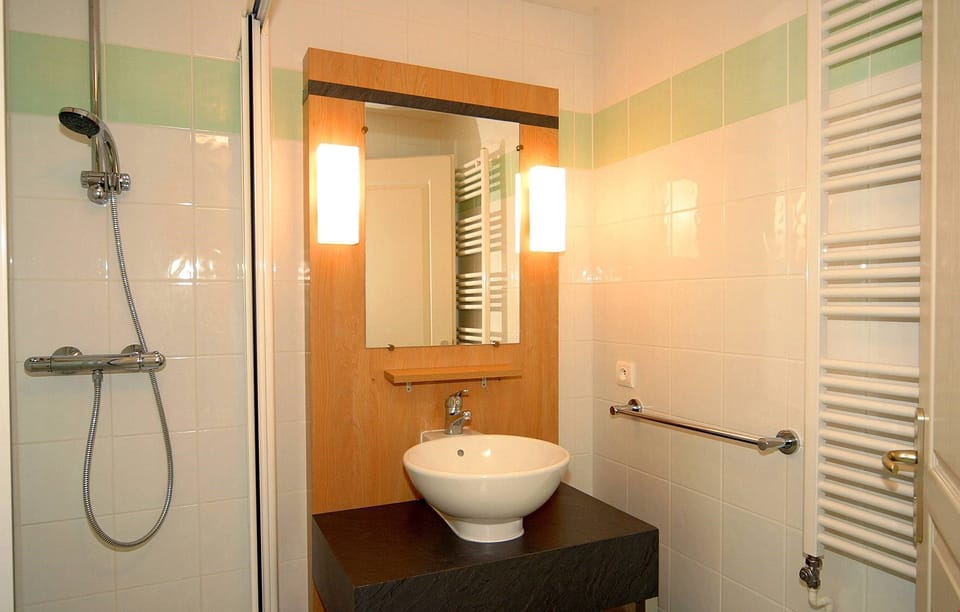 Get ready for your day in the lovely bathroom.