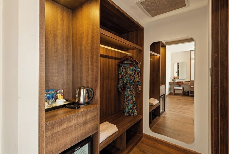 Deluxe Family, Mountain View | Minibar, in-room safe, individually decorated, individually furnished