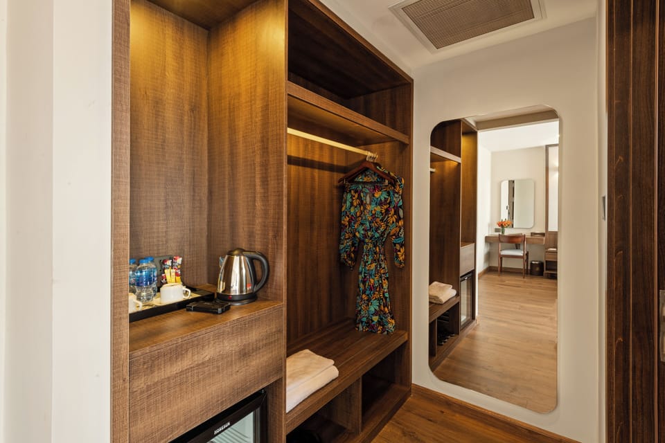 Deluxe Twin Room (Ocean Partial View) | Minibar, in-room safe, desk, iron/ironing board