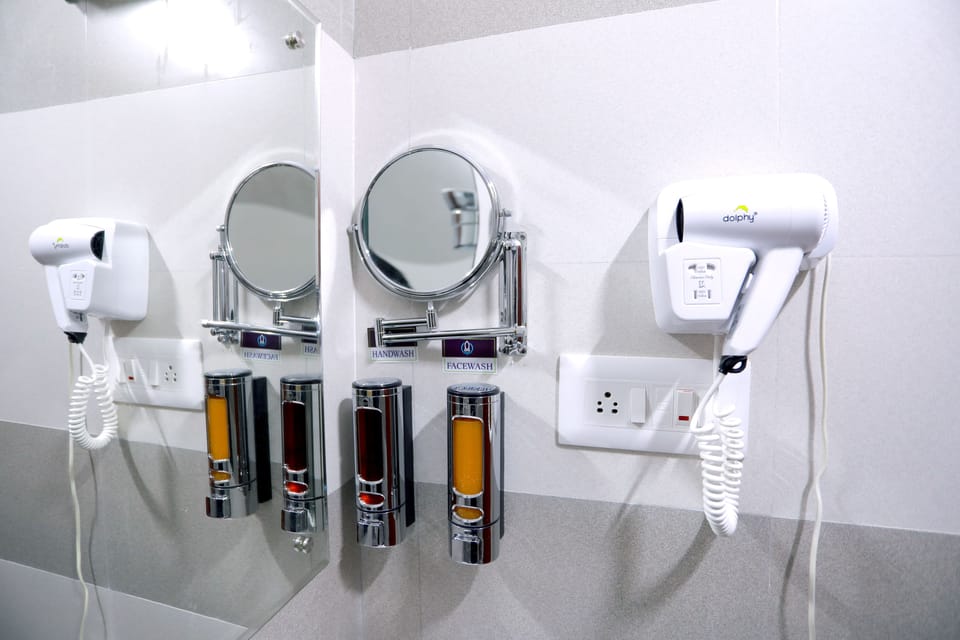 Shower, rainfall showerhead, designer toiletries, hair dryer