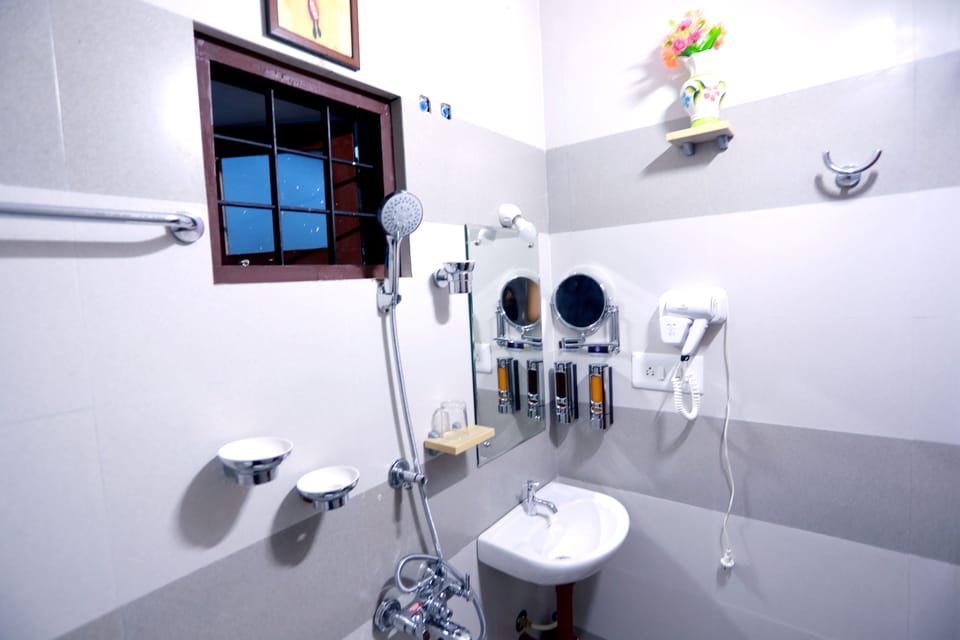 Shower, rainfall showerhead, designer toiletries, hair dryer