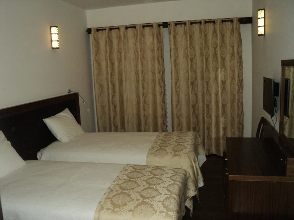 Standard Triple Room, Mountain View | Minibar, in-room safe, soundproofing, free WiFi