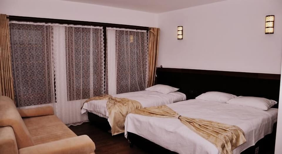 Standard Triple Room, Mountain View | Minibar, in-room safe, soundproofing, free WiFi