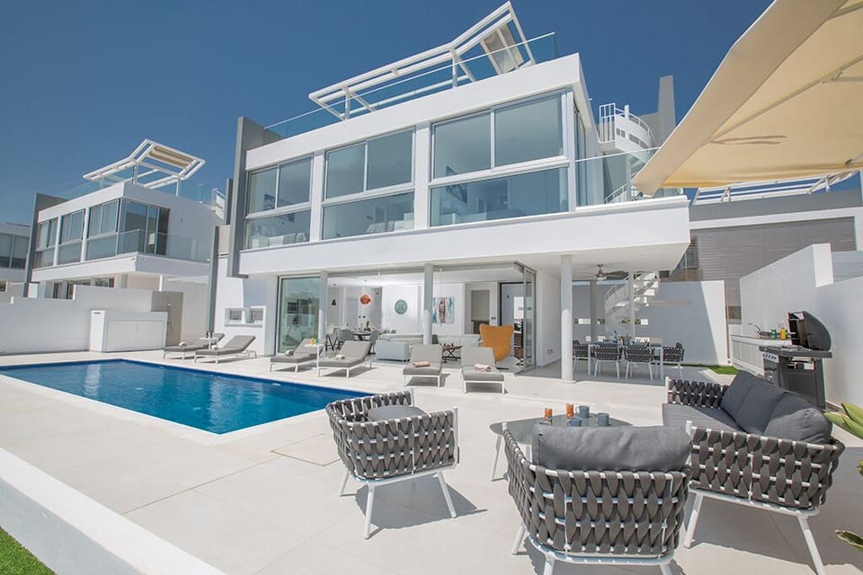 Garden with barbecue, seating area, sun loungers and private pool