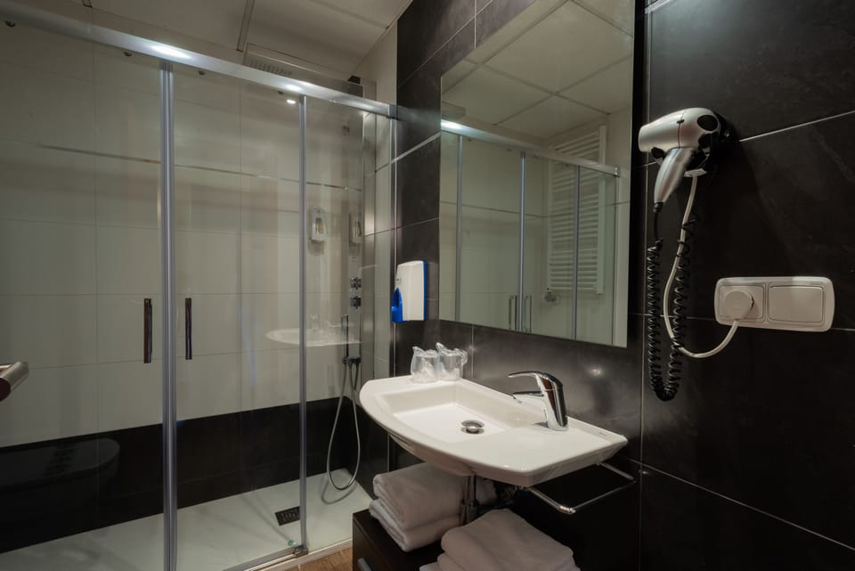 Hair dryer, towels, soap, shampoo