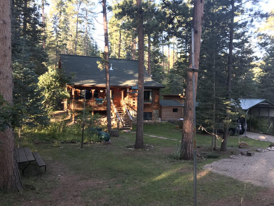 Cabin view with oversized covered parking 