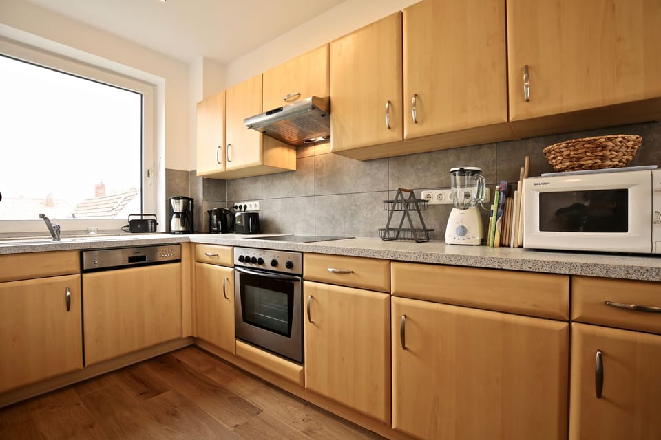Apartment | Private kitchen | Fridge, oven, stovetop, dishwasher