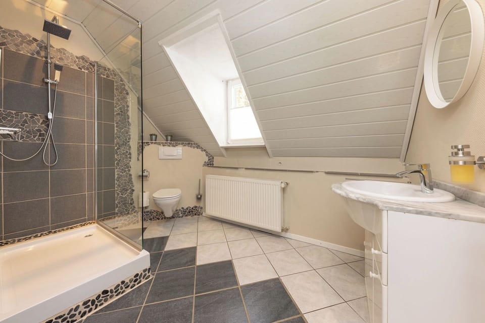 Shower, rainfall showerhead, towels, soap