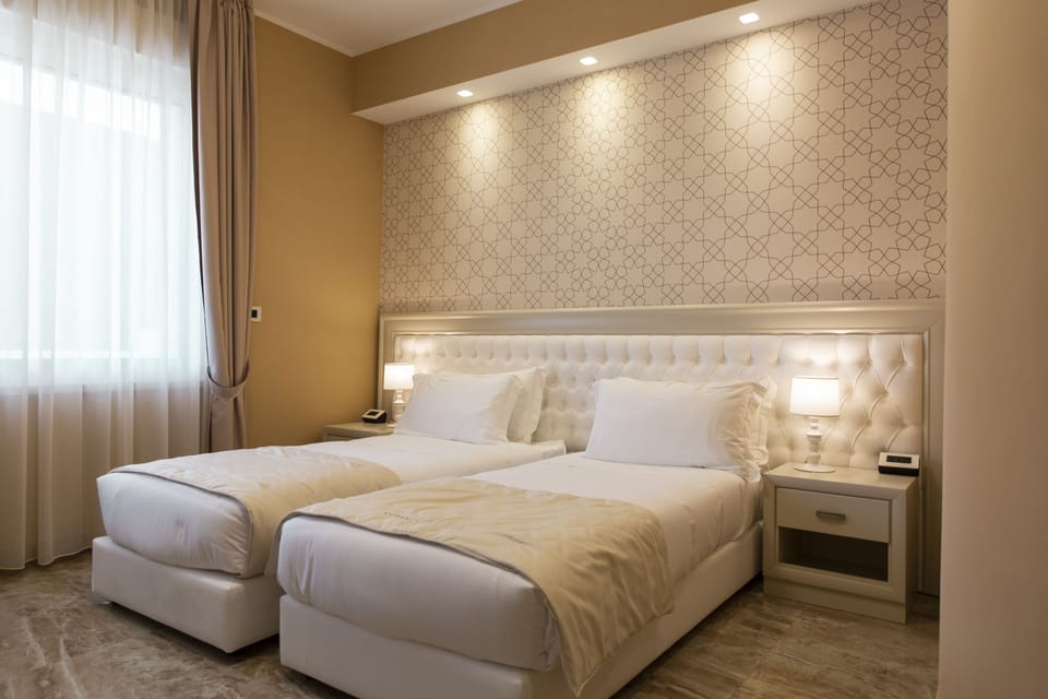 Quadruple Room, Garden View | Minibar, desk, laptop workspace, soundproofing