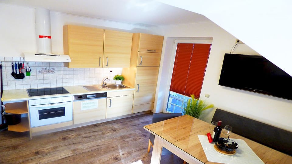 Apartment, Private Bathroom, Lake View (Balkonwohnung C) | Private kitchen | Full-size fridge, microwave, oven, stovetop