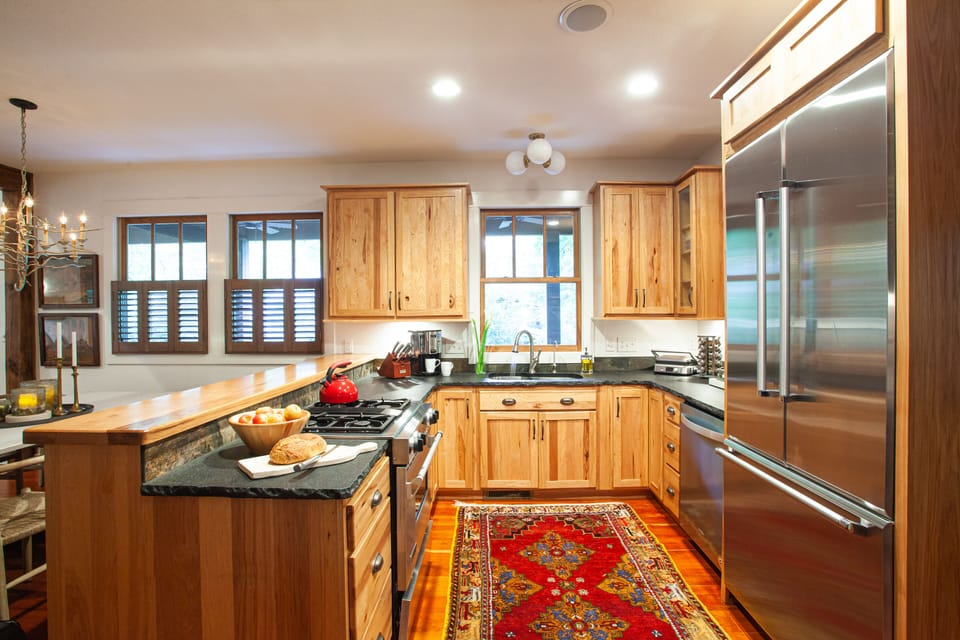 Chef's kitchen with gas range and dishwasher.
