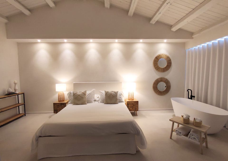 Luxury Suite, 1 Double Bed, Bathtub, Garden View | Down comforters, minibar, individually decorated, individually furnished