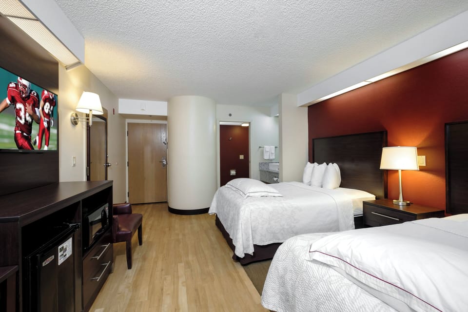 Premium Room, 2 Double Beds, Poolside (Upgraded Bedding & Snack, Smoke Free) | Desk, laptop workspace, blackout drapes, iron/ironing board