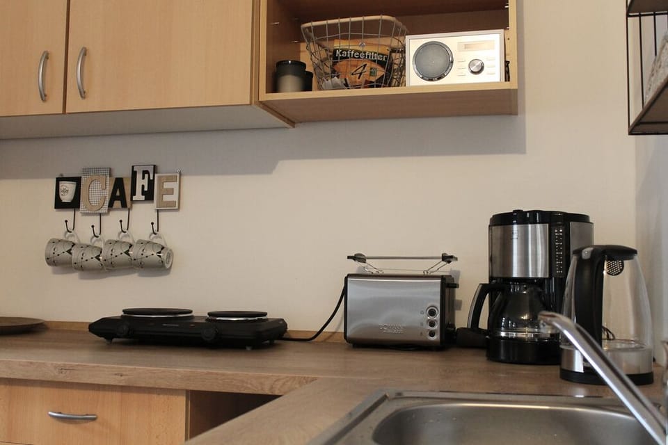 Quadruple Room (Büttner 1) | Private kitchenette | Coffee/tea maker, electric kettle