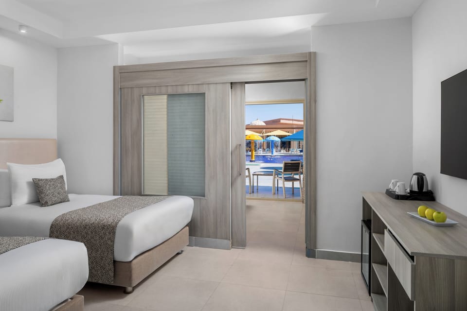 Family Bungalow with Pool View | Hypo-allergenic bedding, minibar, in-room safe, desk