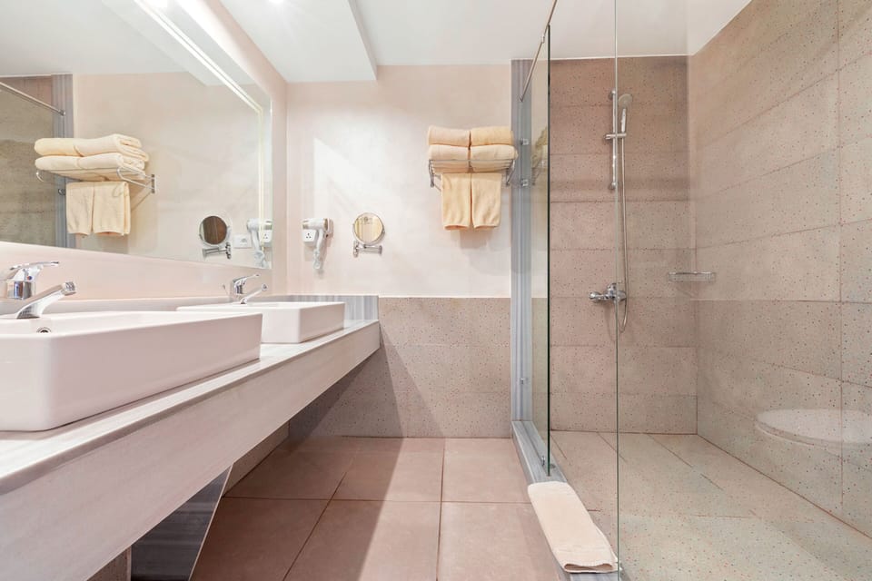Shower, free toiletries, hair dryer, slippers