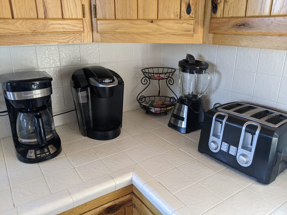 Standard drip and Keurig coffee makers.  Fully stocked with pots/pans/utensils.