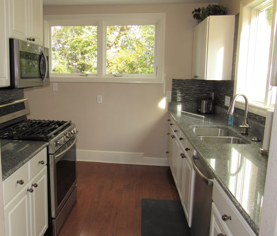 The kitchen is spacious and has plenty of counter space. 
