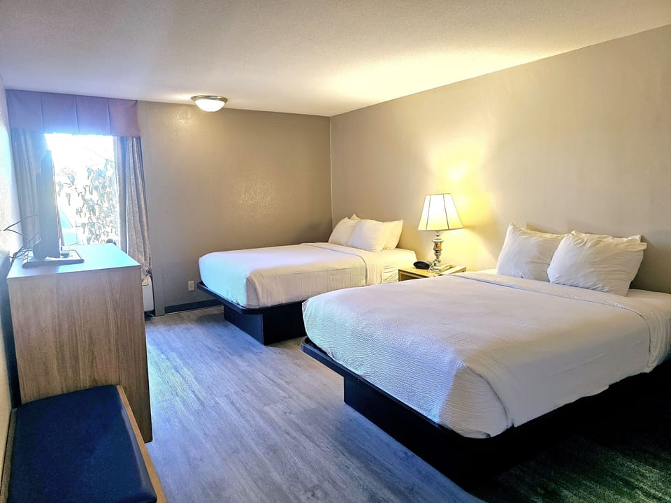 Room, 2 Queen Beds, Non Smoking | Desk, iron/ironing board, free cribs/infant beds, Internet