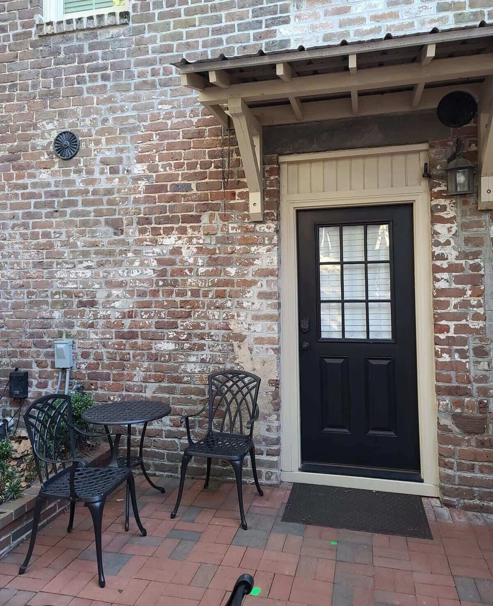 This is the Carriage House entrance with private code & bistro table & chairs for your morning cupajoe or cocktails.