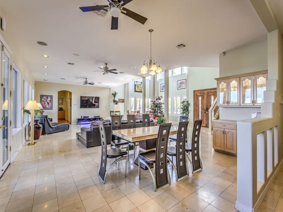 Dining room with china cabinet open to living room and kitchen