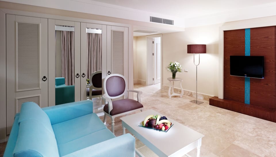Family Suite, Partial Sea View | Minibar, in-room safe, iron/ironing board, free cribs/infant beds