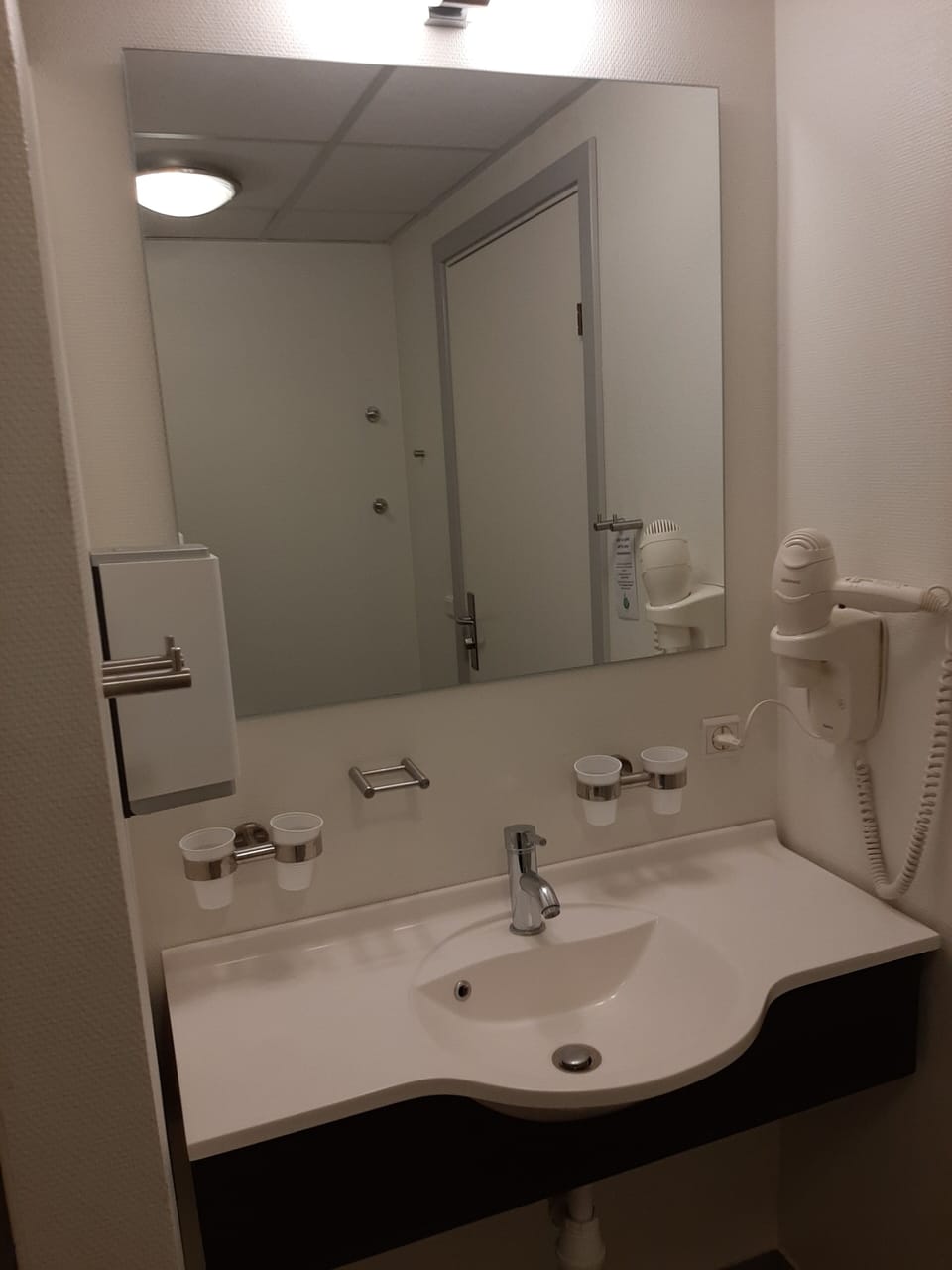 Shower, hair dryer, towels, toilet paper