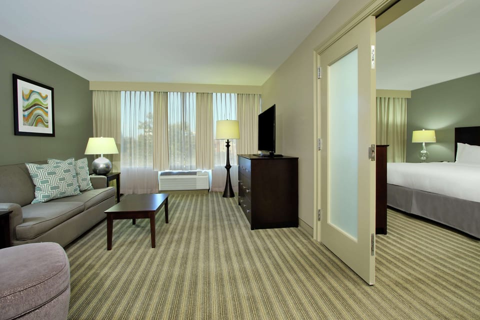 Suite, 1 King Bed | Living area | 39-inch flat-screen TV with cable channels, TV