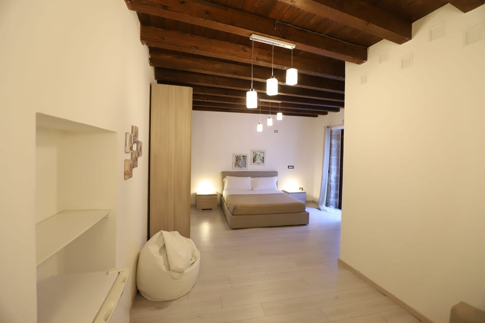 Deluxe Studio | Premium bedding, blackout drapes, soundproofing, free cribs/infant beds