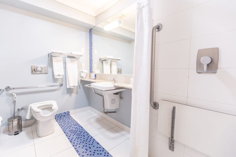 Suite, 1 King Bed, Accessible | Bathroom | Shower, designer toiletries, hair dryer, towels