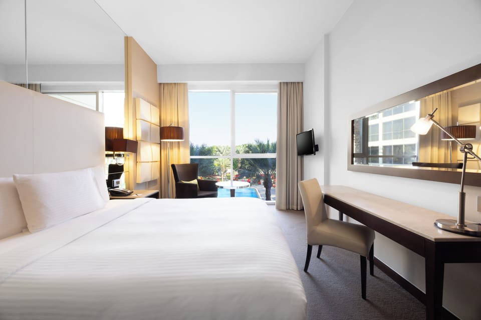 Room, 1 Queen Bed, Pool View | In-room safe, desk, blackout drapes, soundproofing