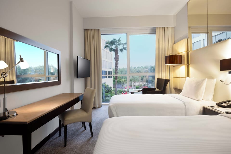 Room, 2 Twin Beds, Pool View | In-room safe, desk, blackout drapes, soundproofing