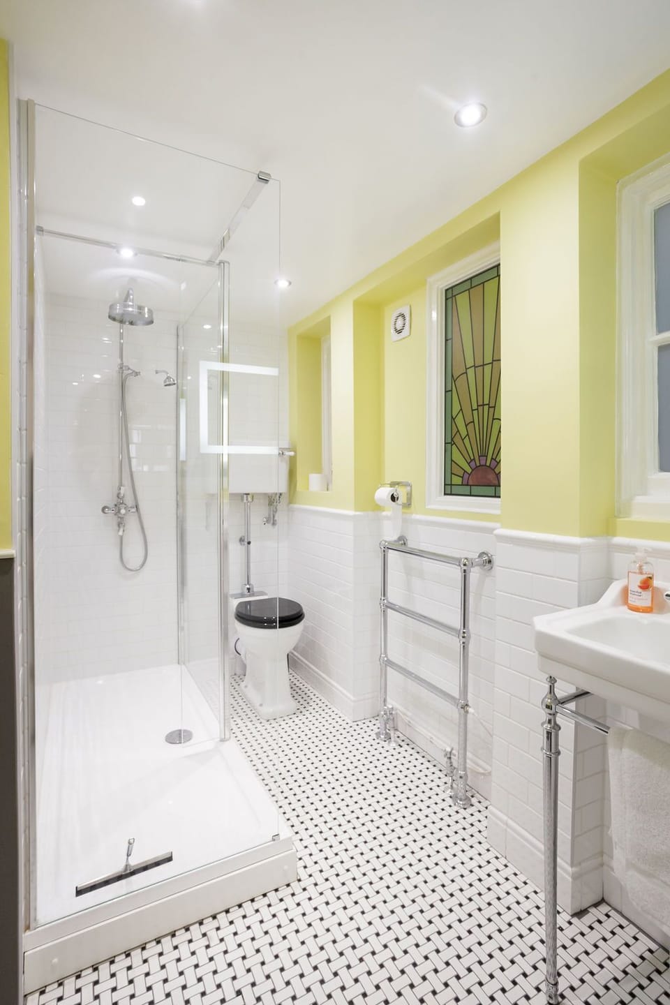 1920s bathroom next to bedrooms with walk in shower and underfloor heating.