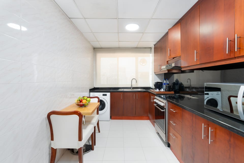 Three Bedroom Premier Suite | Private kitchen | Electric kettle, dining tables
