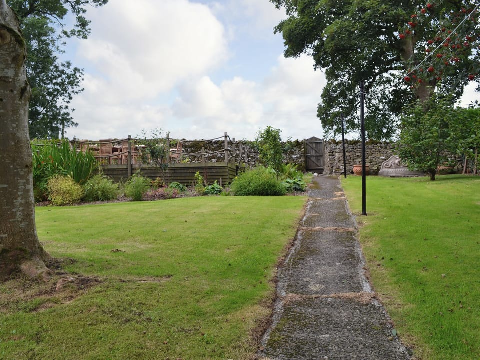 The garden is home to raised decked area with views over the countryside | The Rockery - Rockery Cottages, Shap, near Penrith