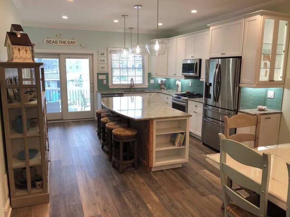 View of kitchen from dining room.  The kitchen is fully stocked and ready for use