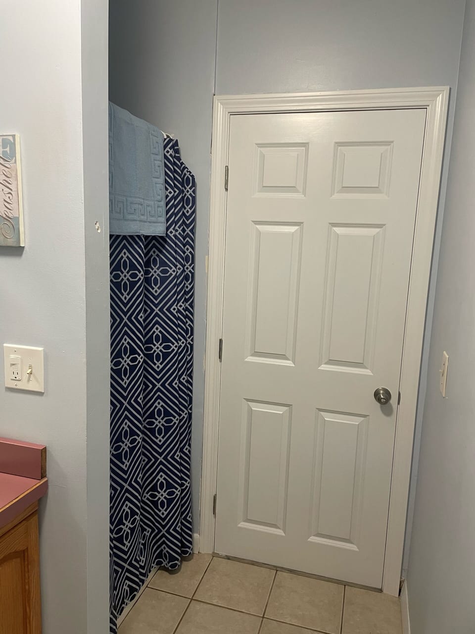 Bottom floor bathroom with a shower. New door throughout house added in 2022. 