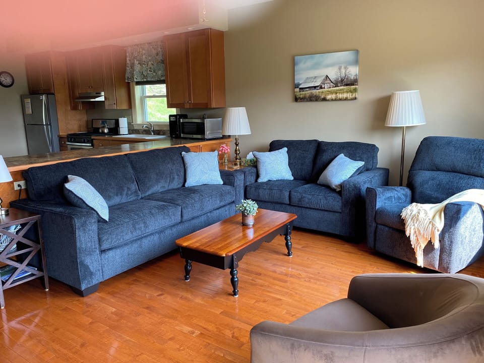 Sofa, loveseat, tub swivel chair, and a recliner. 