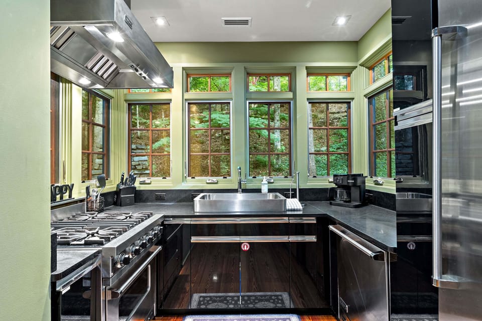 High-end kitchen featuring Viking appliances, dishwasher, and standard drip-style coffeemaker.